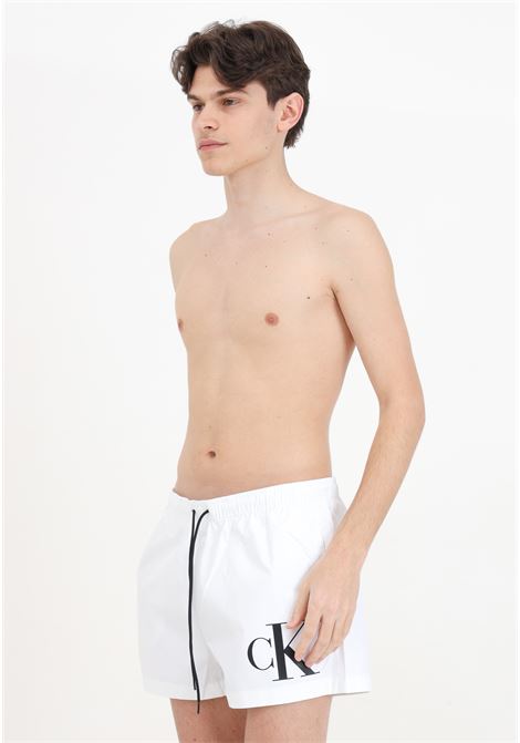 White men's swim shorts with CK monogram print CALVIN KLEIN | KM0KM01015YCD